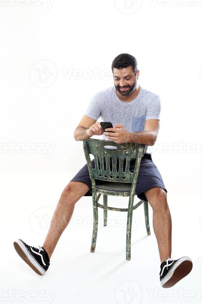 young man with a beard in several different situations photo