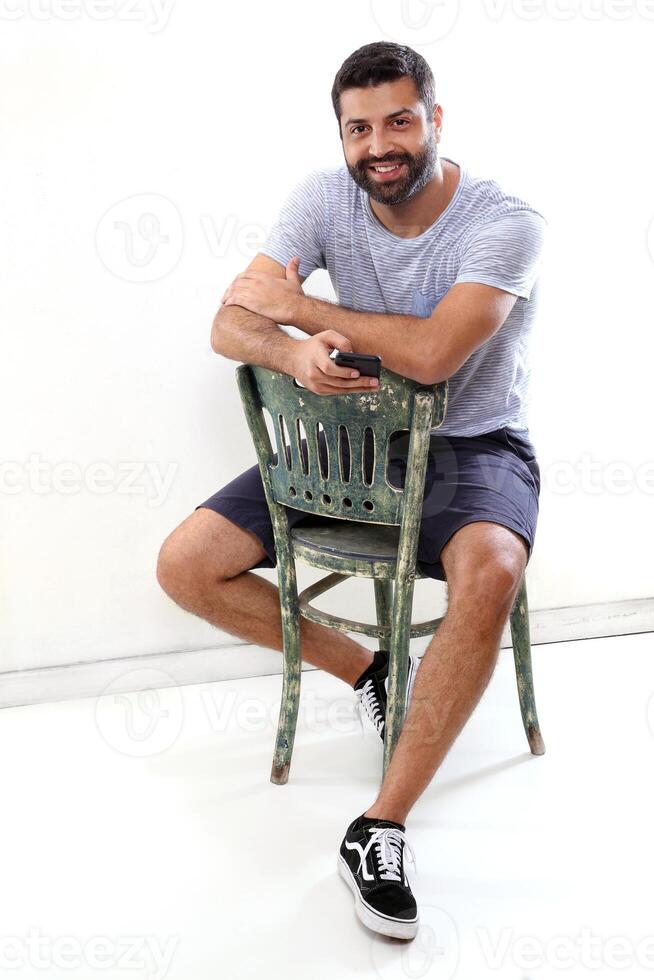 young man with a beard in several different situations photo