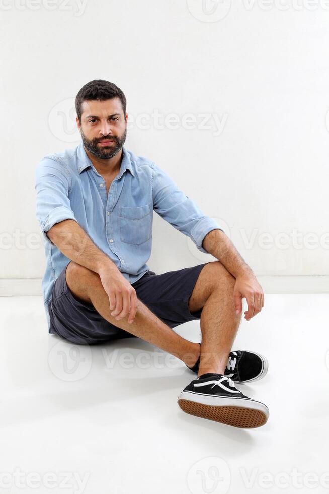 young man with a beard in several different situations photo