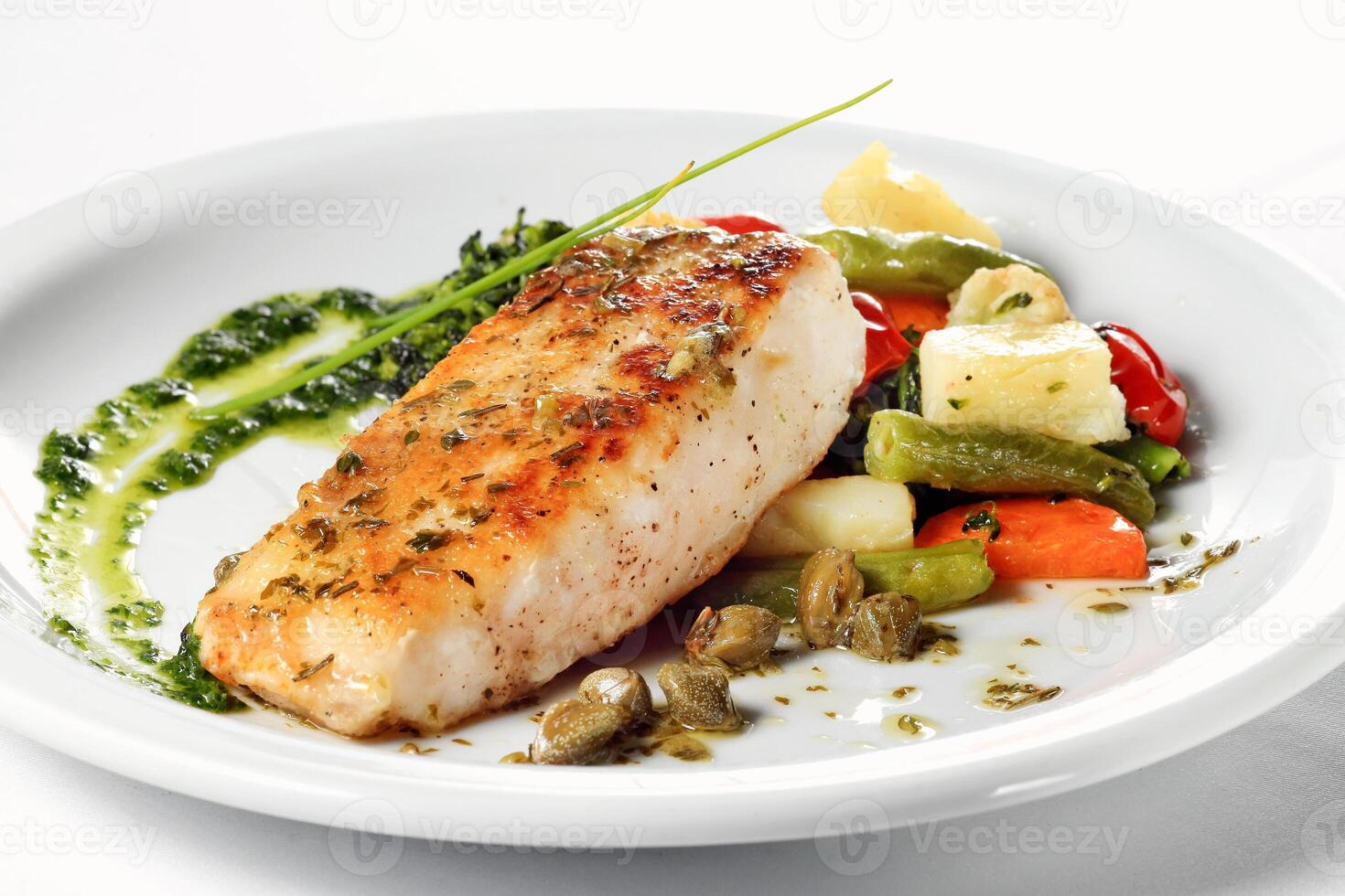 Grilled Pirarucu, typical Amazonian fish with vegetables and sauce photo