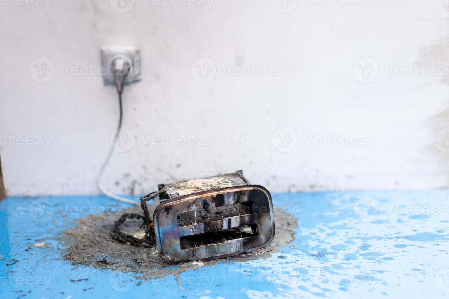 Toaster after fire. Household electrical appliance fire hazard photo