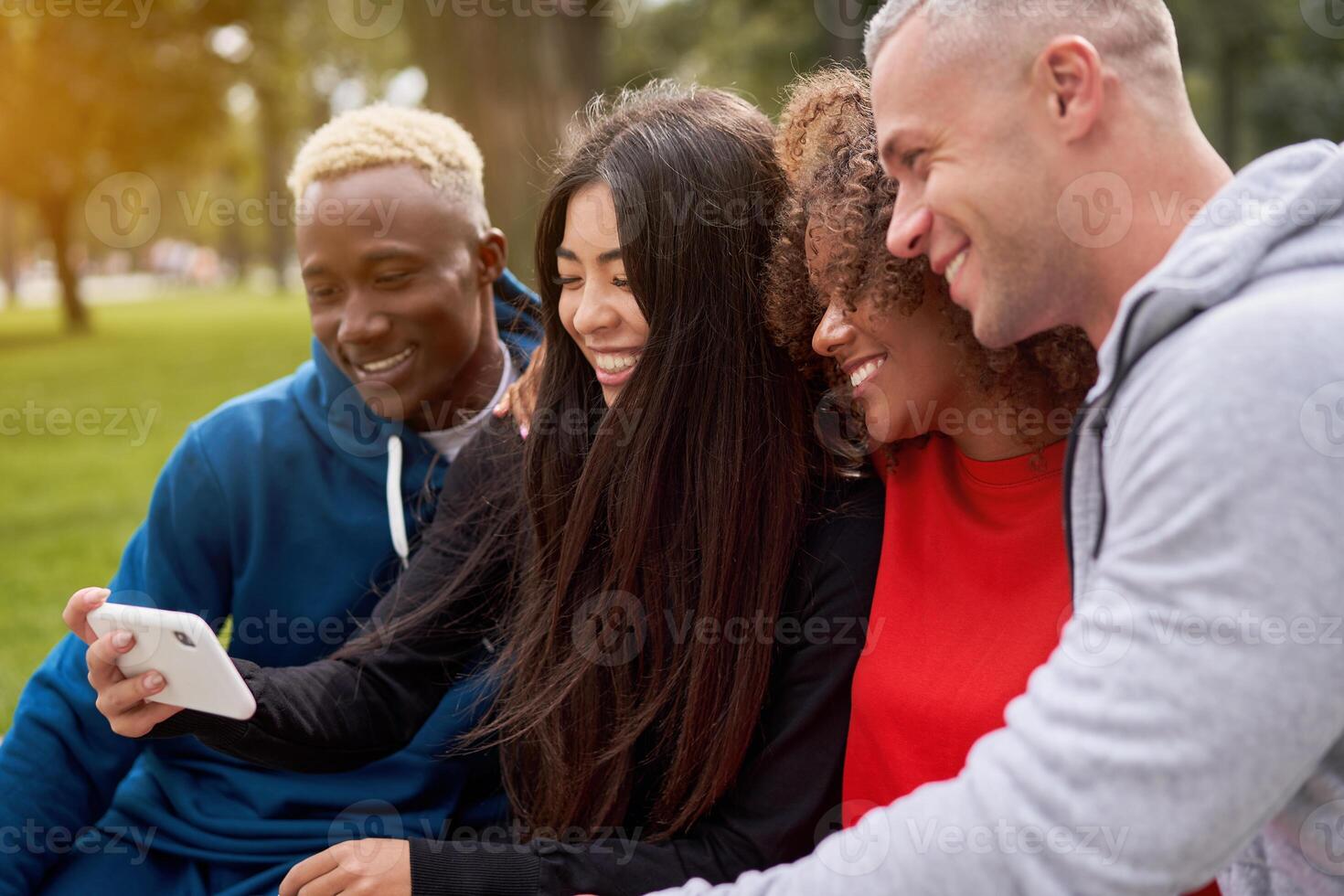 Multi ethnic friends outdoor. Diverse group people Afro american asian caucasian spending time together photo