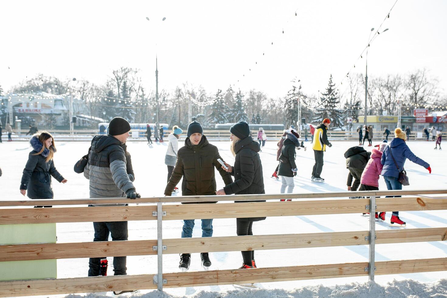 Ukraine, Kharkov 30 December 2018 People skate in the city park on Freedom Square. Excellent family leisure on weekends and holidays. photo