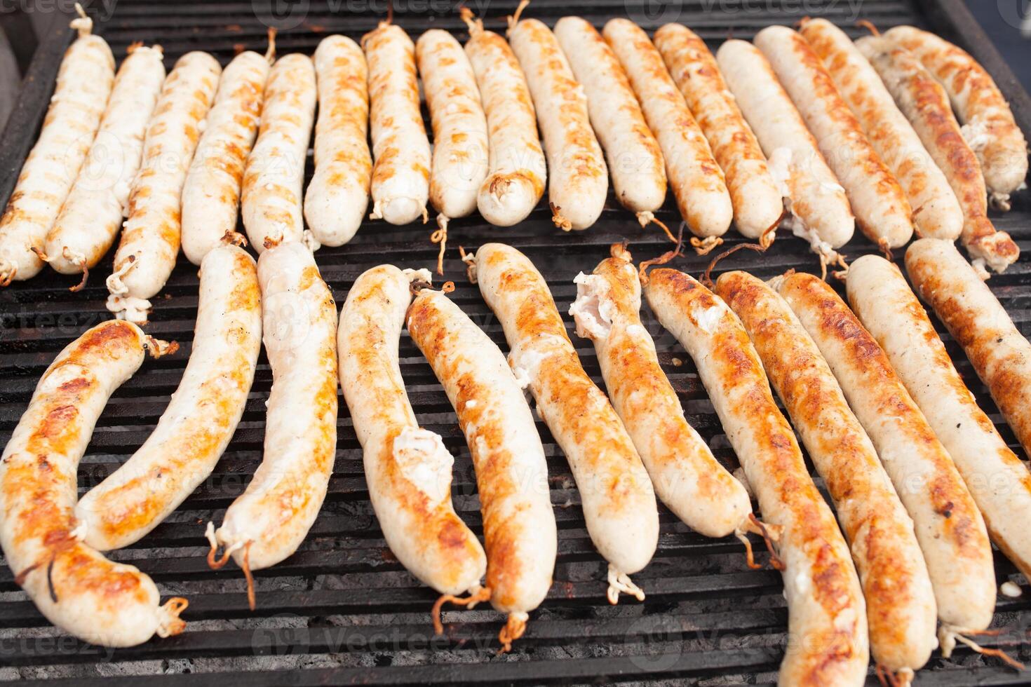 BBQ with fiery sausages on the grill photo