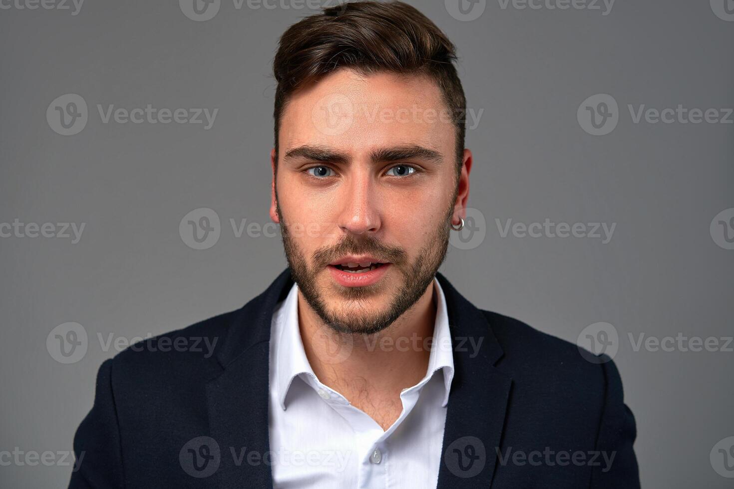 Close up portrait young man businessman. Caucasian guy business suit studio gray background. photo