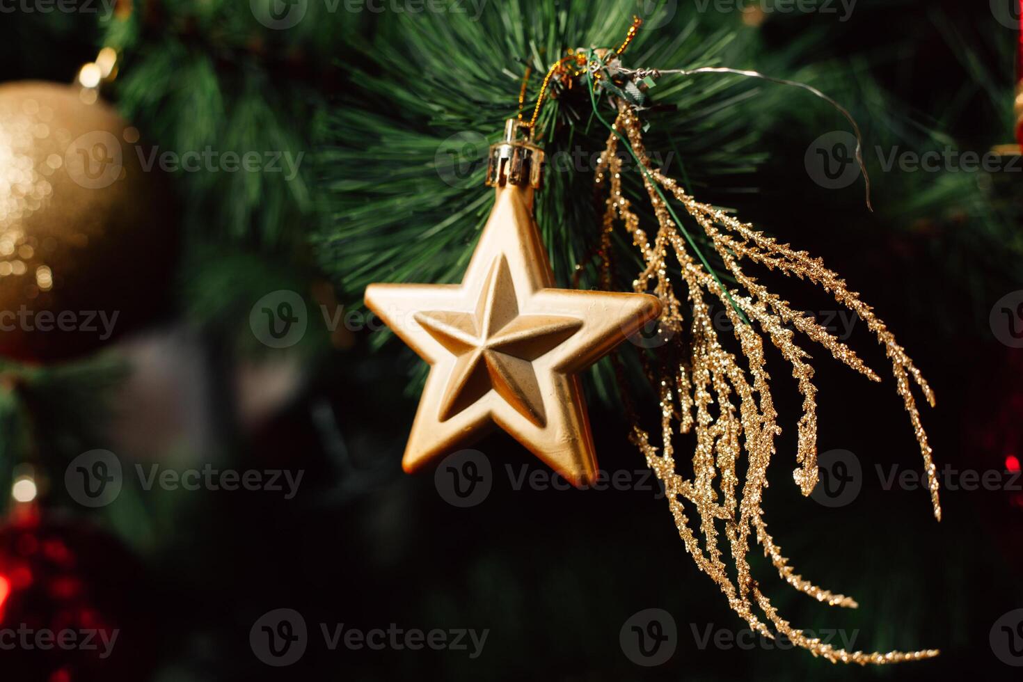 Christmas toy on the Christmas tree. Decorated Christmas tree ball. Christmas ball close up. Selective focus. photo