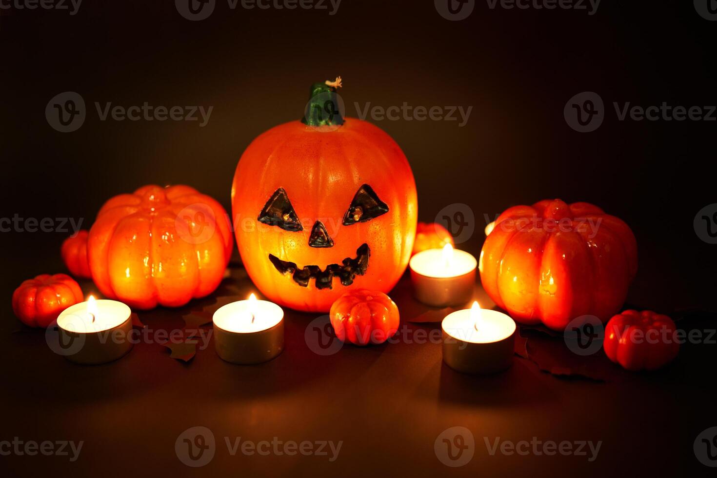Halloween background, orange decorative plastic pumpkin black paper bat black cardboard Thanksgiving greeting card photo