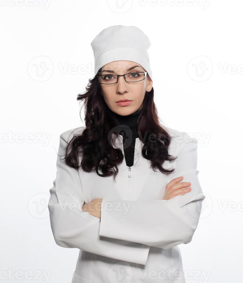a woman in a white lab coat and glasses photo