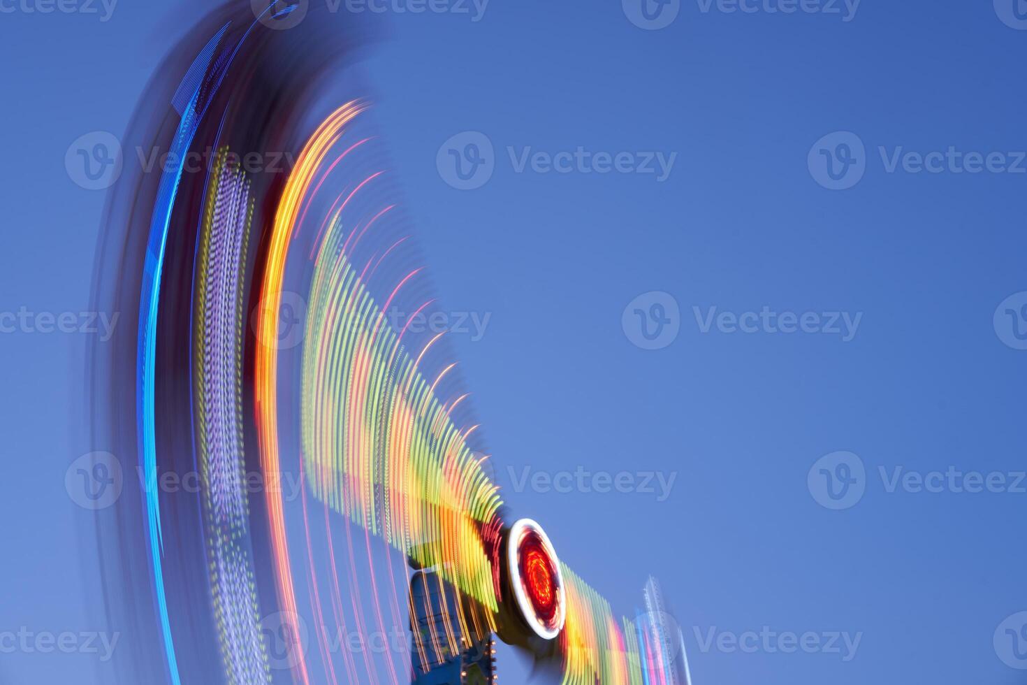 Amusement park blurred effect. Abstract illuminated background photo
