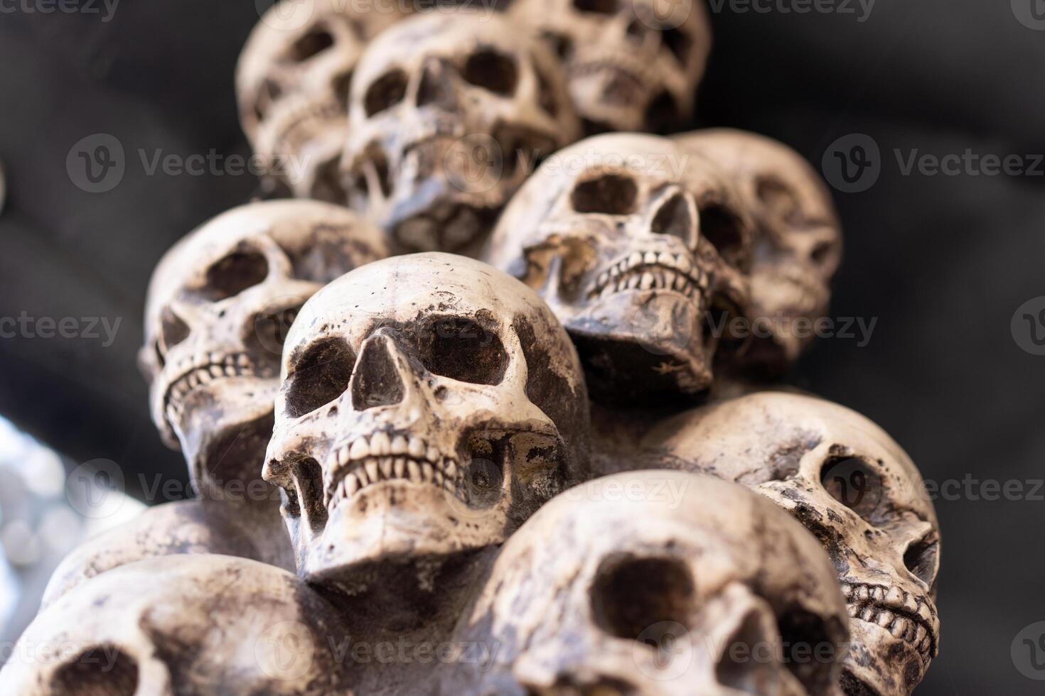 Skull Halloween Background Many People Skulls Stand on top of each other. Mystic creepy concept. Abstract nightmare occult memorial photo