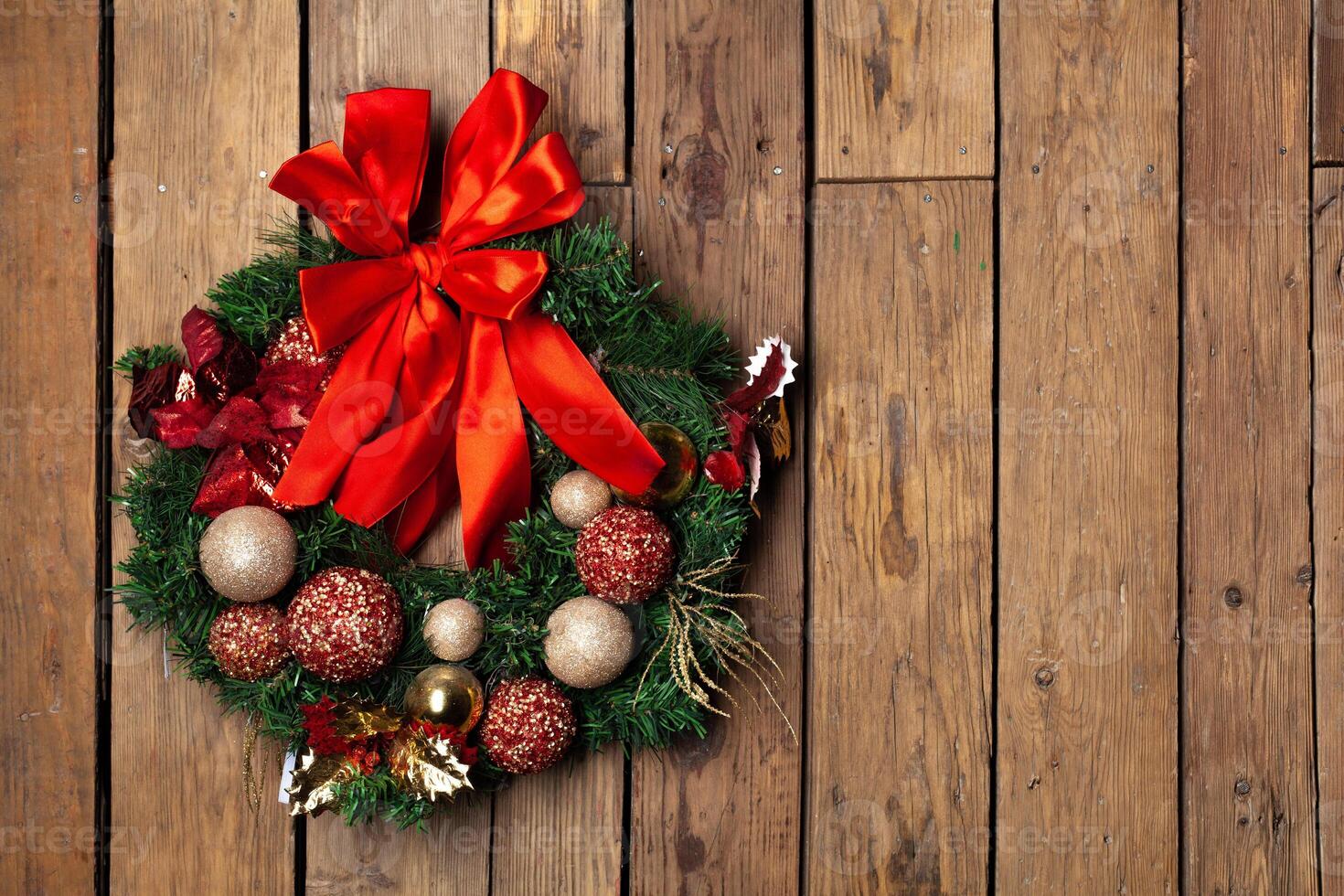 Advent Christmas wreath on wooden door or wall decoration photo