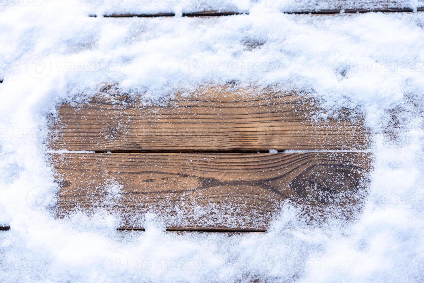 Winter background. Empty wooden plank with snow border, copy space for text photo