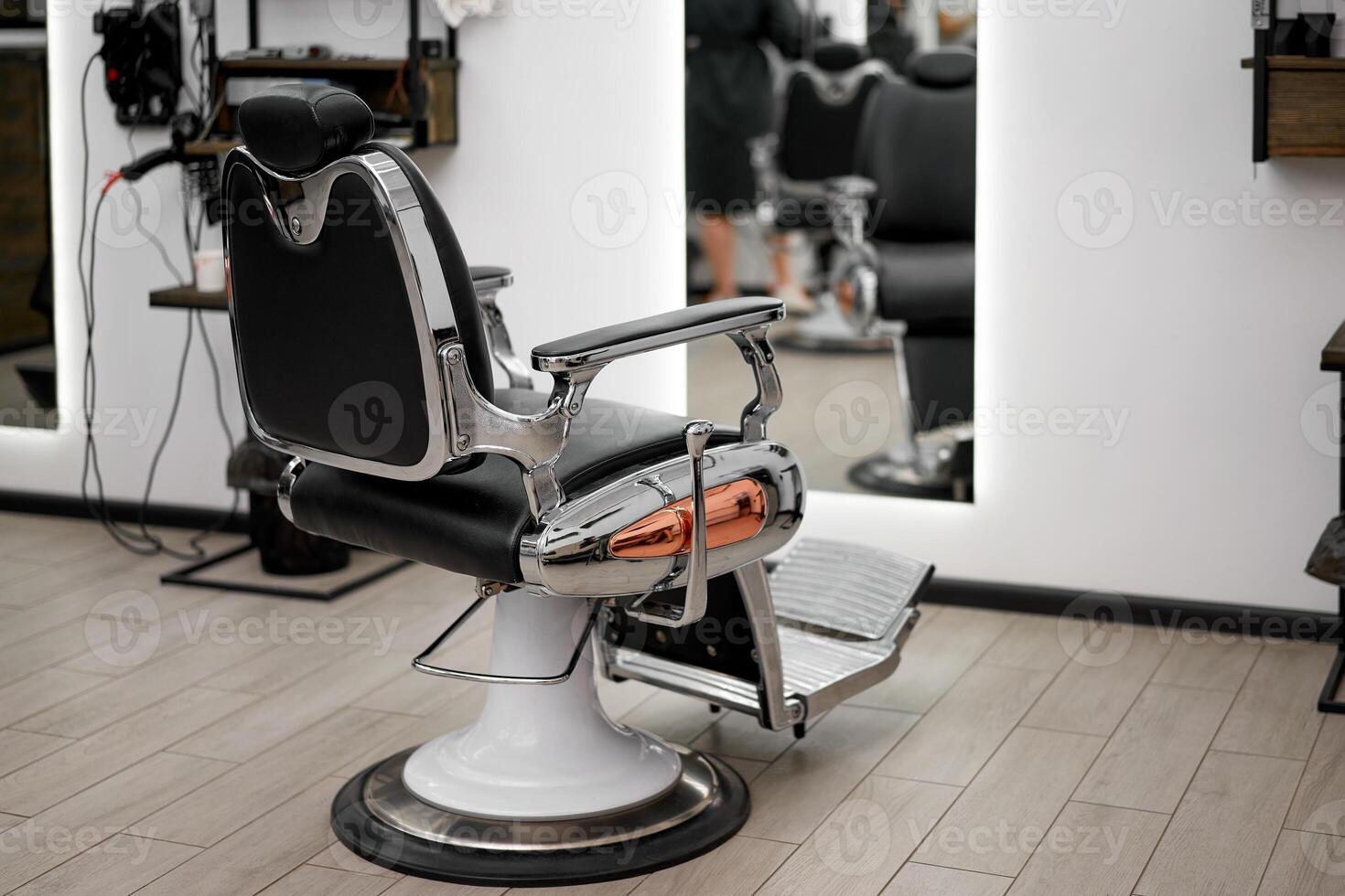 Classic vintage barber chair stands opposite mirror stylish white barber shop interior. photo