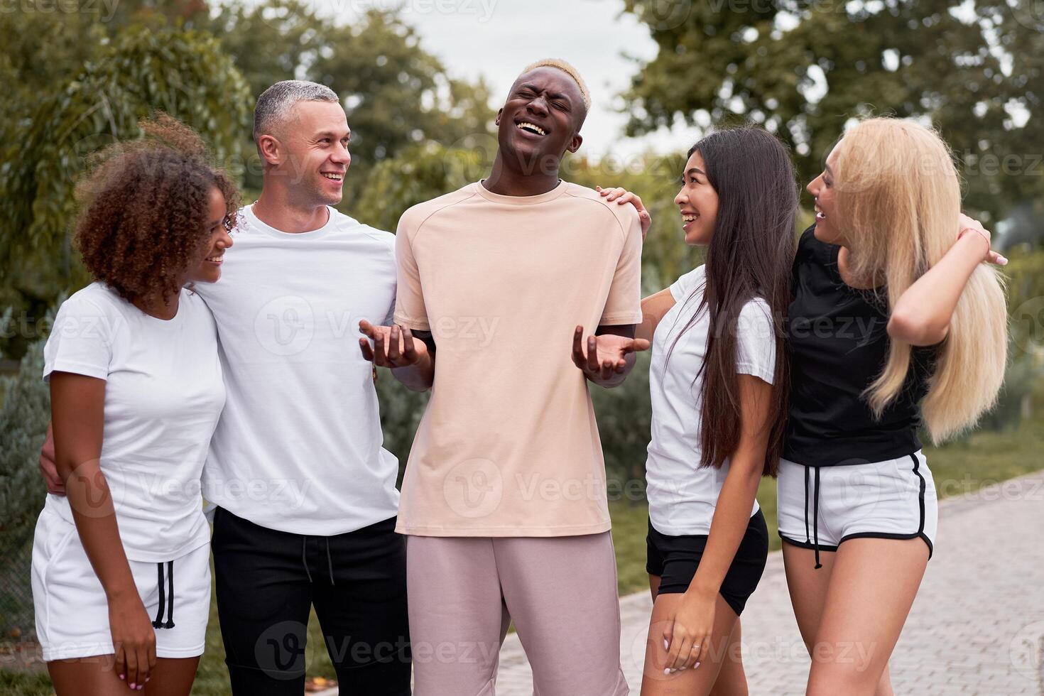 Multi-ethnic group people teenage friends. African-american, asian, caucasian student spending time together Multiracial friendship photo