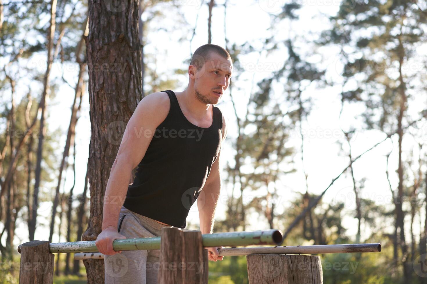 Handsome caucasian men push up outdoor workout cross training morning Pumping triceps arm exercising sports ground photo