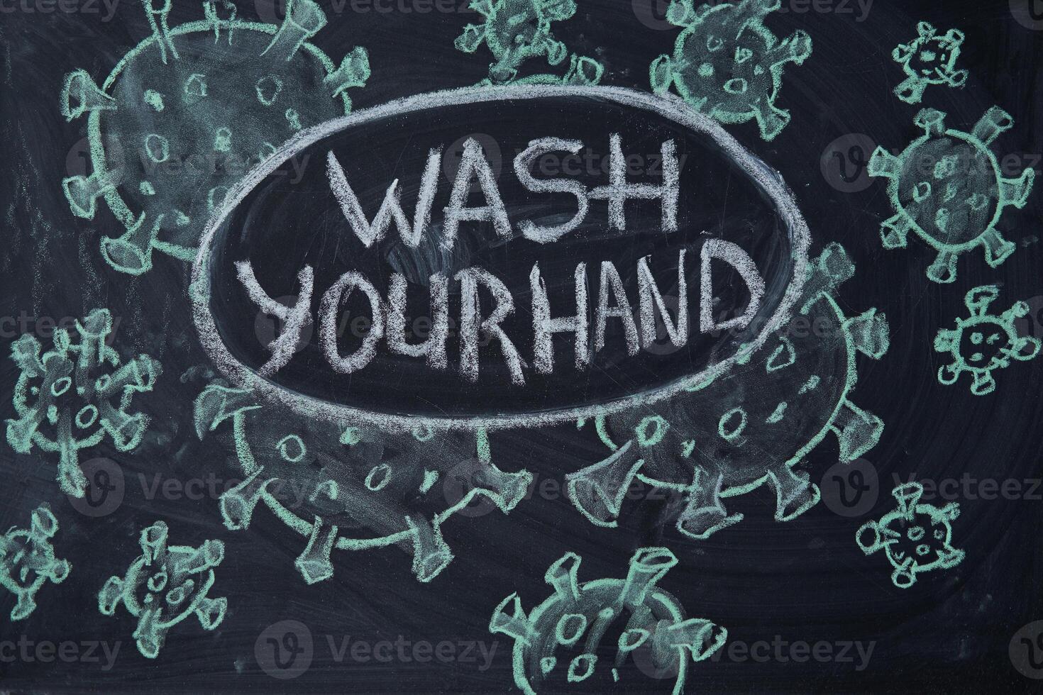 Wash your hand. Outbreak Warning. written white chalk on blackboard in connection with epidemic of coronavirus worldwide. photo