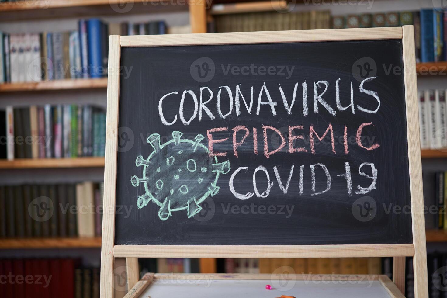 Outbreak Warning. written white chalk on blackboard in connection with epidemic of coronavirus worldwide. photo
