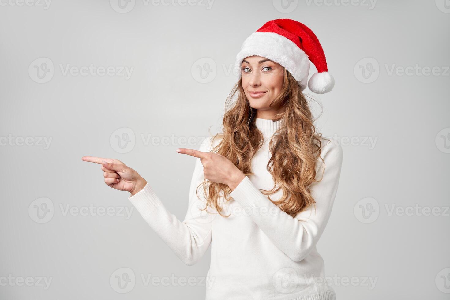 Woman christmas Santa Hat sweater white studio background photo