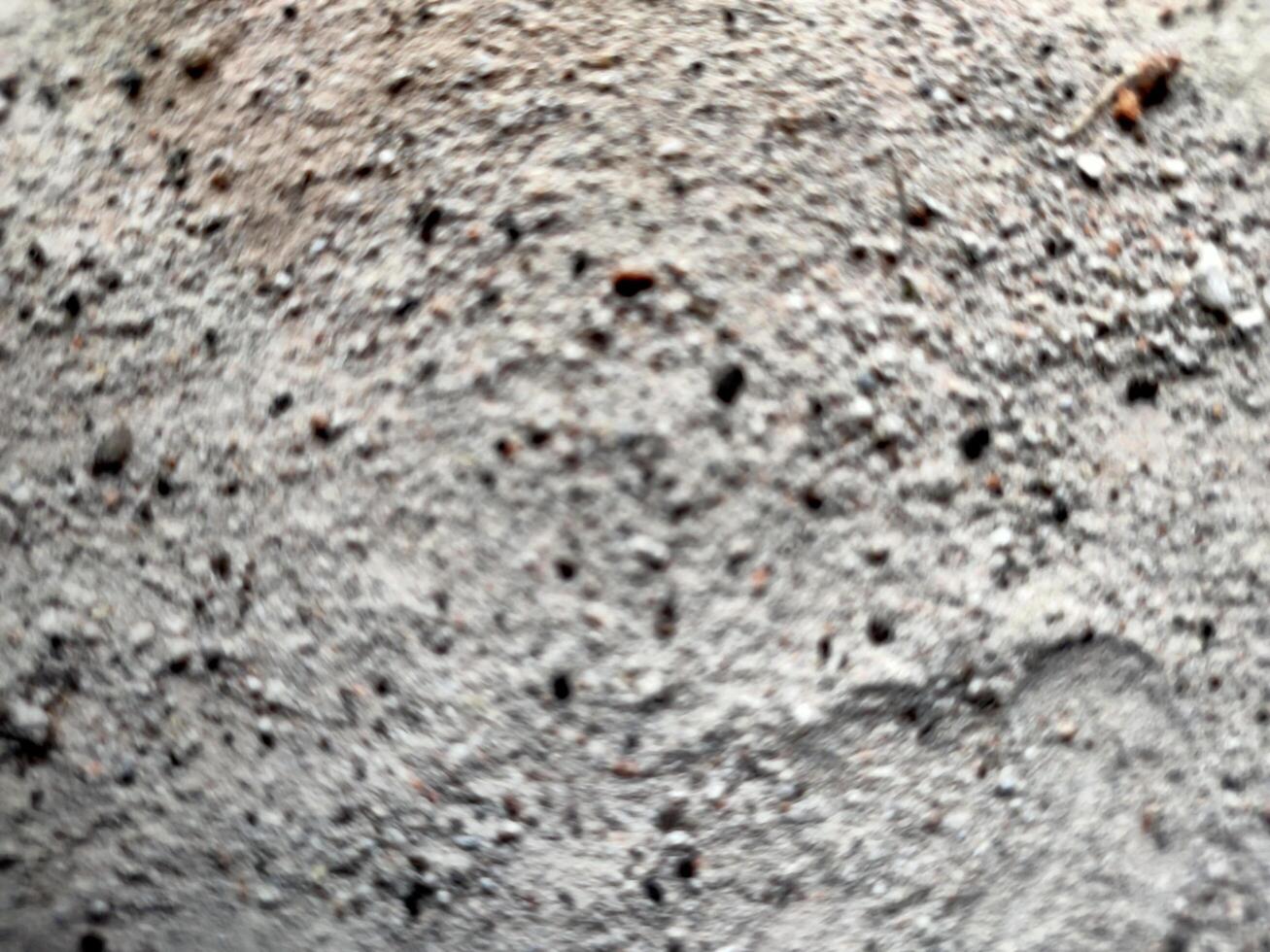 Out of focus, blur background of ruins consisting of sand, brick, stone, dust and soil photo