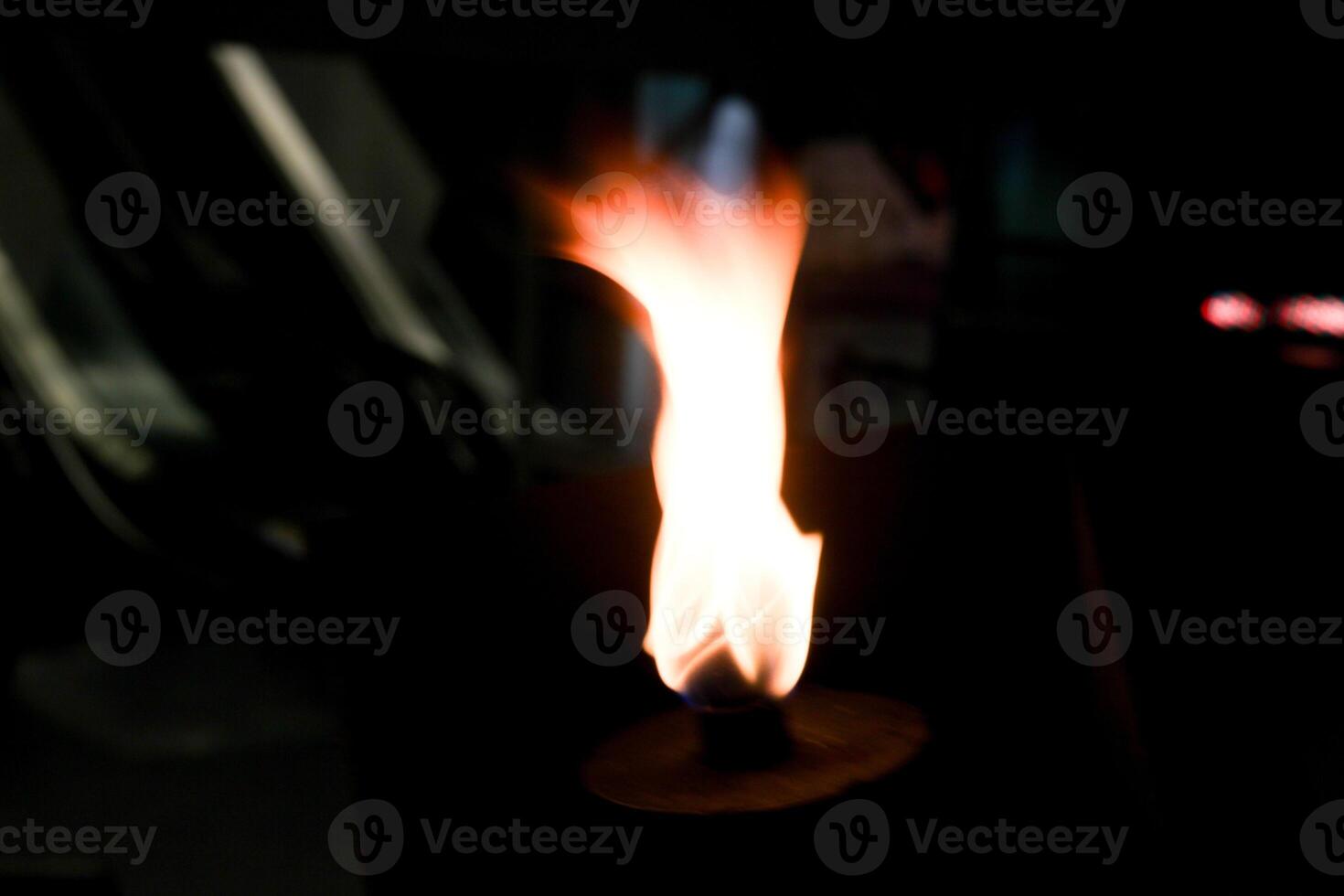 burning fire in the fireplace candle burning in the dark photo