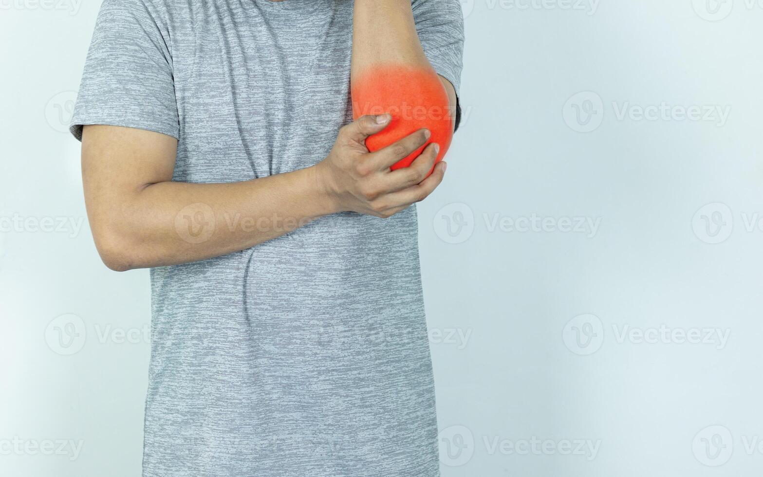 Man suffering from pain in elbow on white background photo