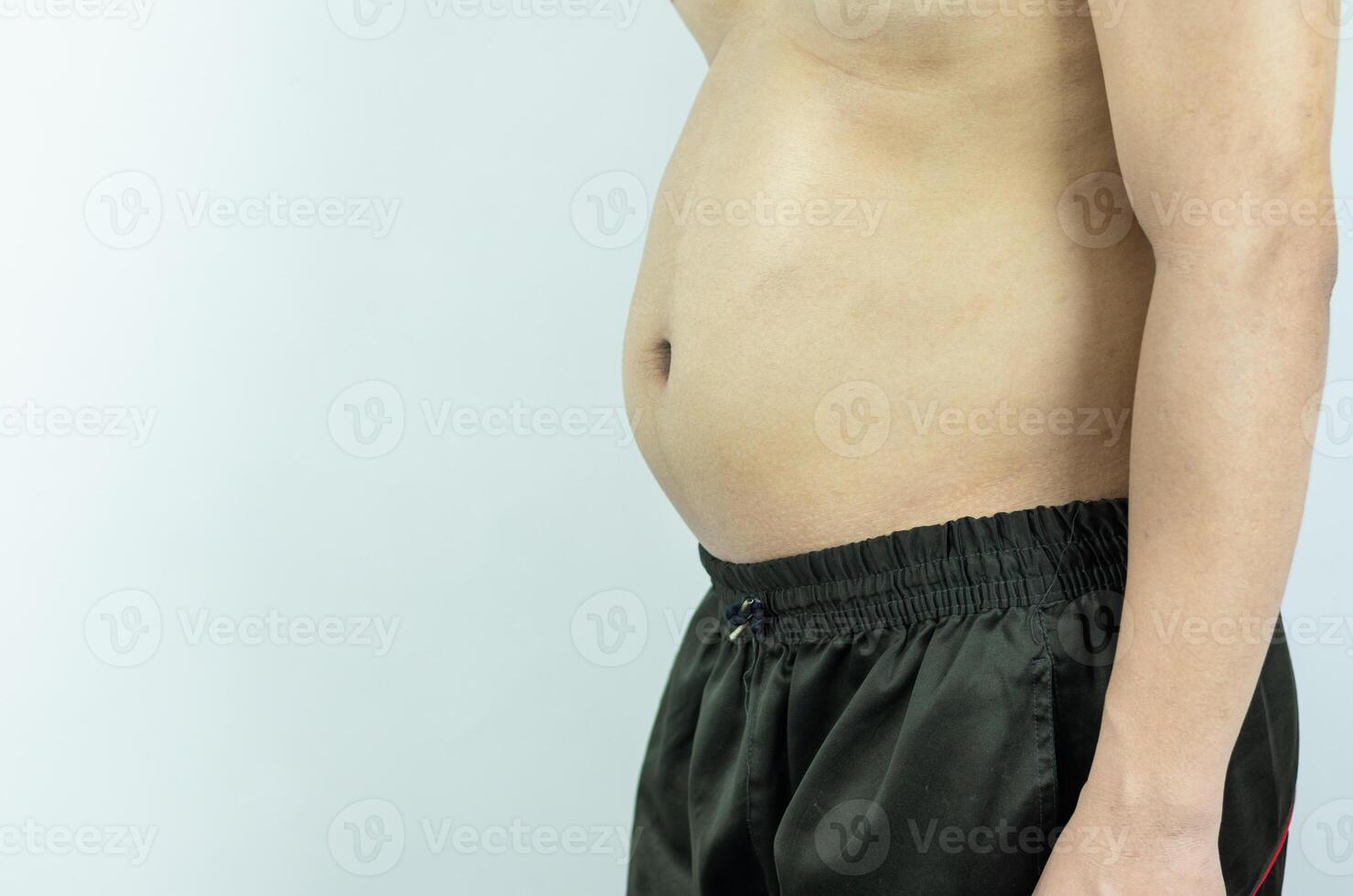 Men with pot bellies or belly fat. Close-up of body parts photo