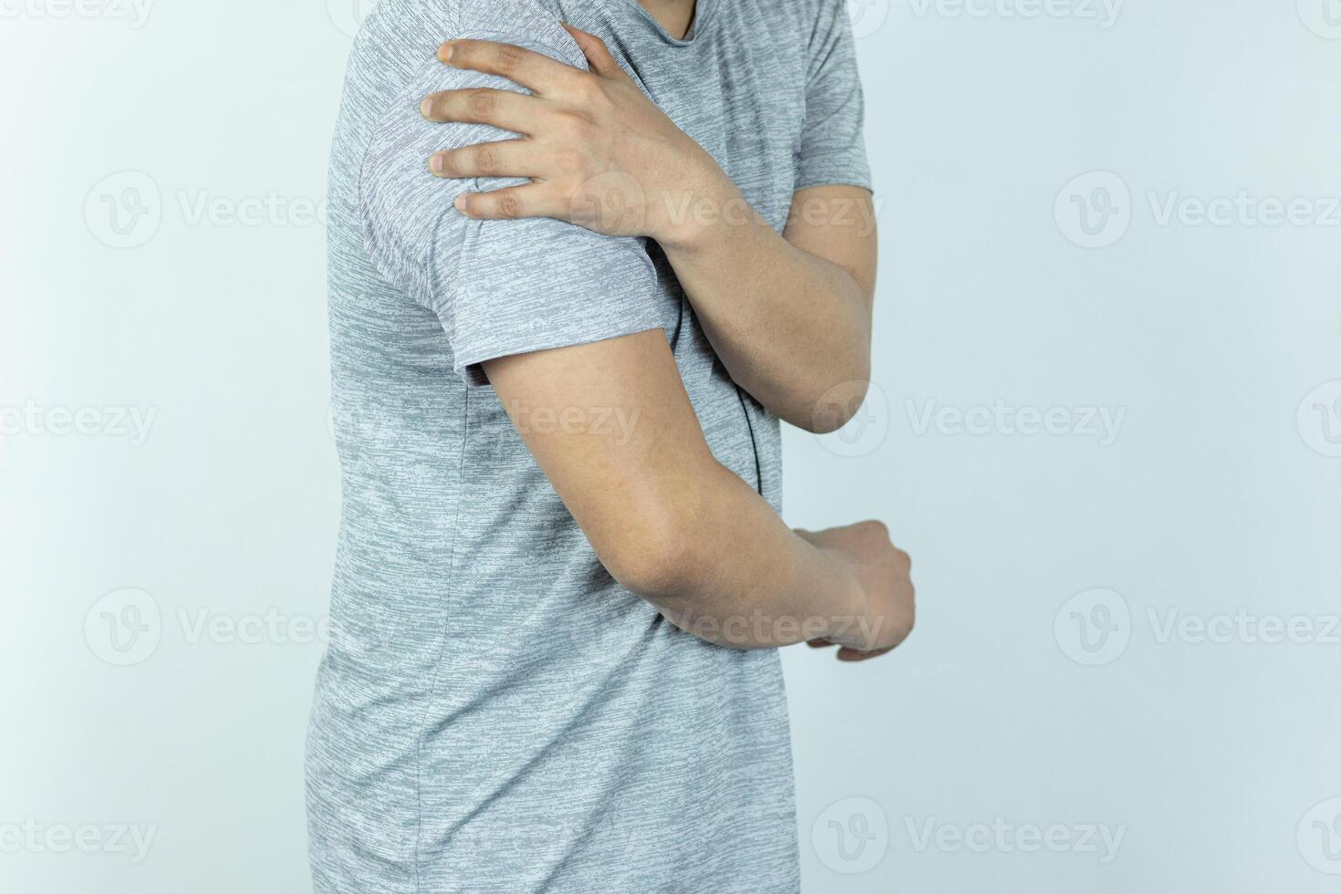 Man suffering from shoulder pain on white background photo