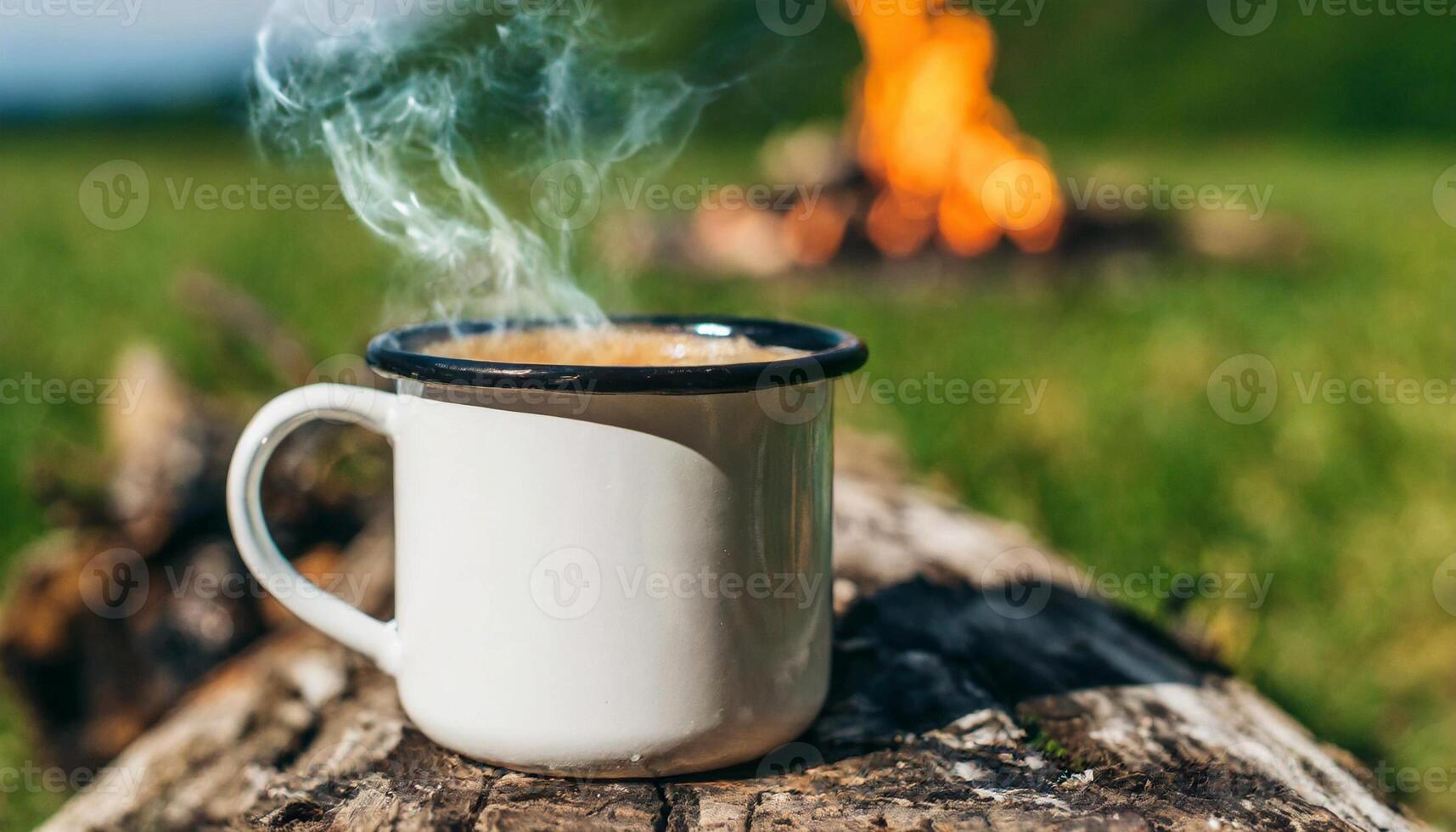 AI generated Enamel cup of hot steaming coffee on old log by an outdoor campfire. Tasty drink. photo
