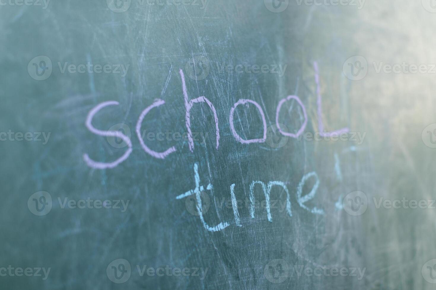 Chalkboard with wooden frame and the text school time photo