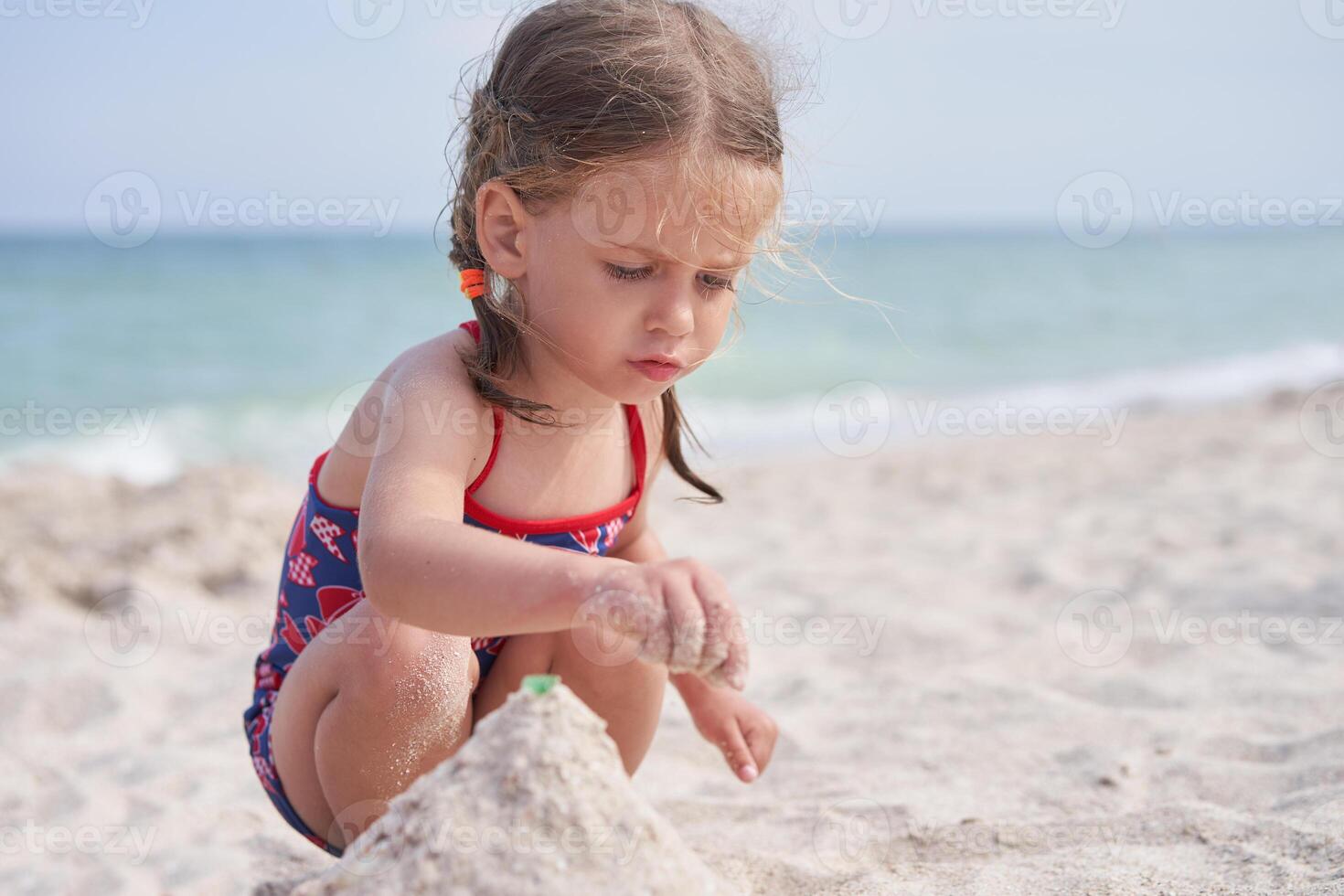 Child playing sand beach Little girl play sad alone summer family vacation photo