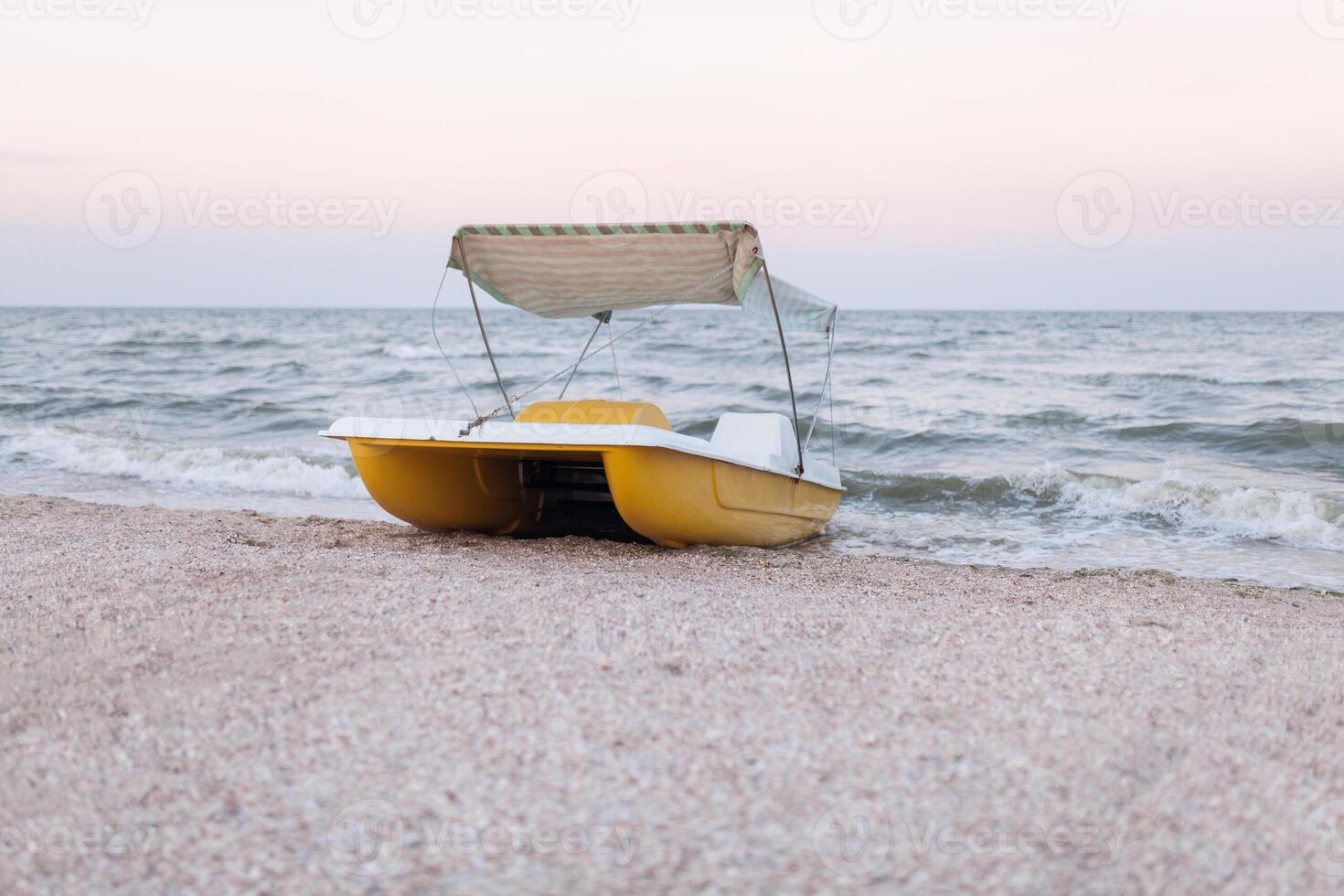 A catamaran standing on a beach with roof Evening time No people photo