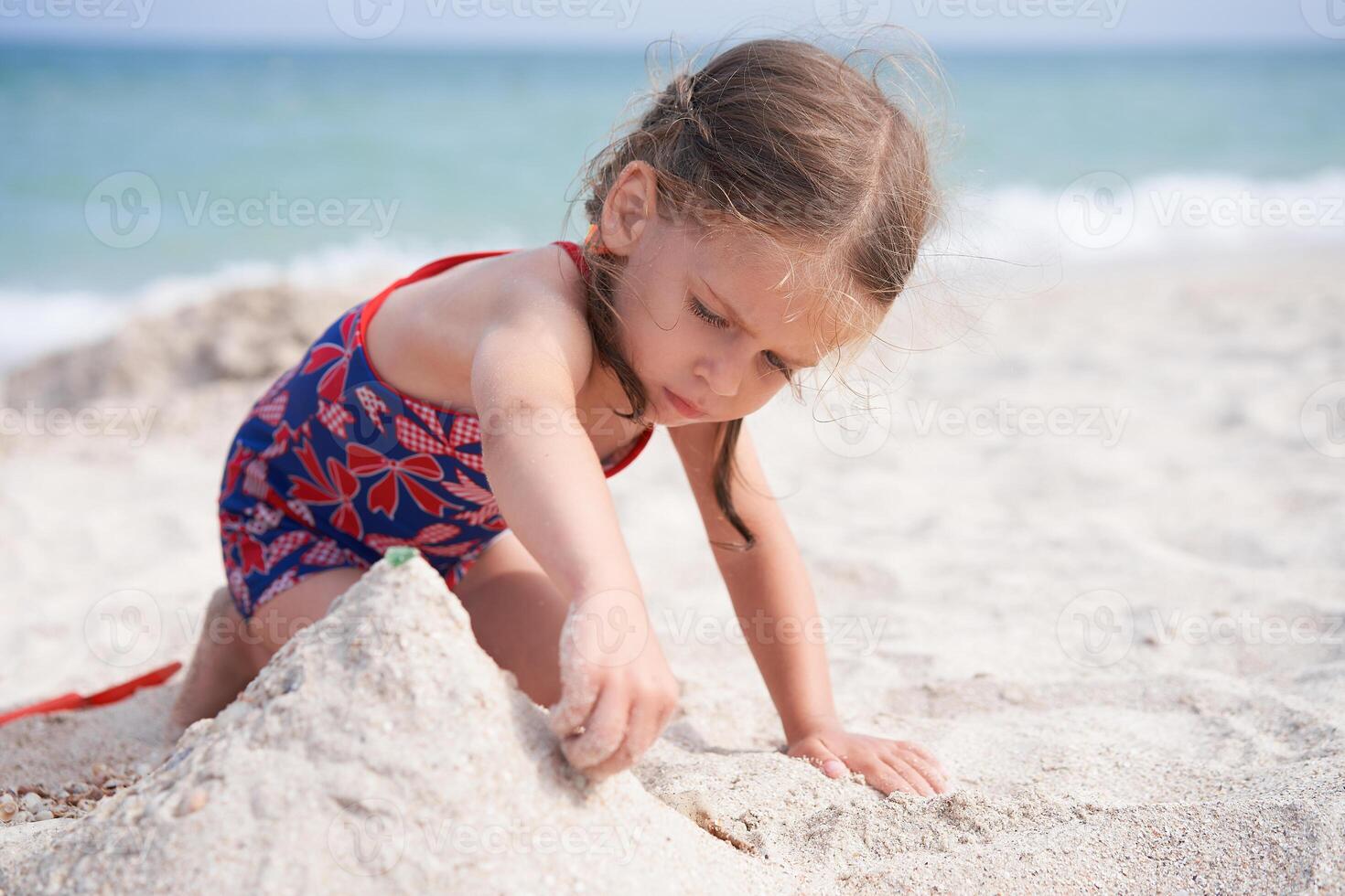 Child playing sand beach Little girl play sad alone summer family vacation photo