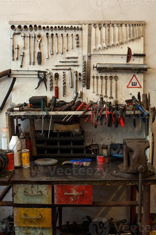 many dirty tools on table and dashboard photo