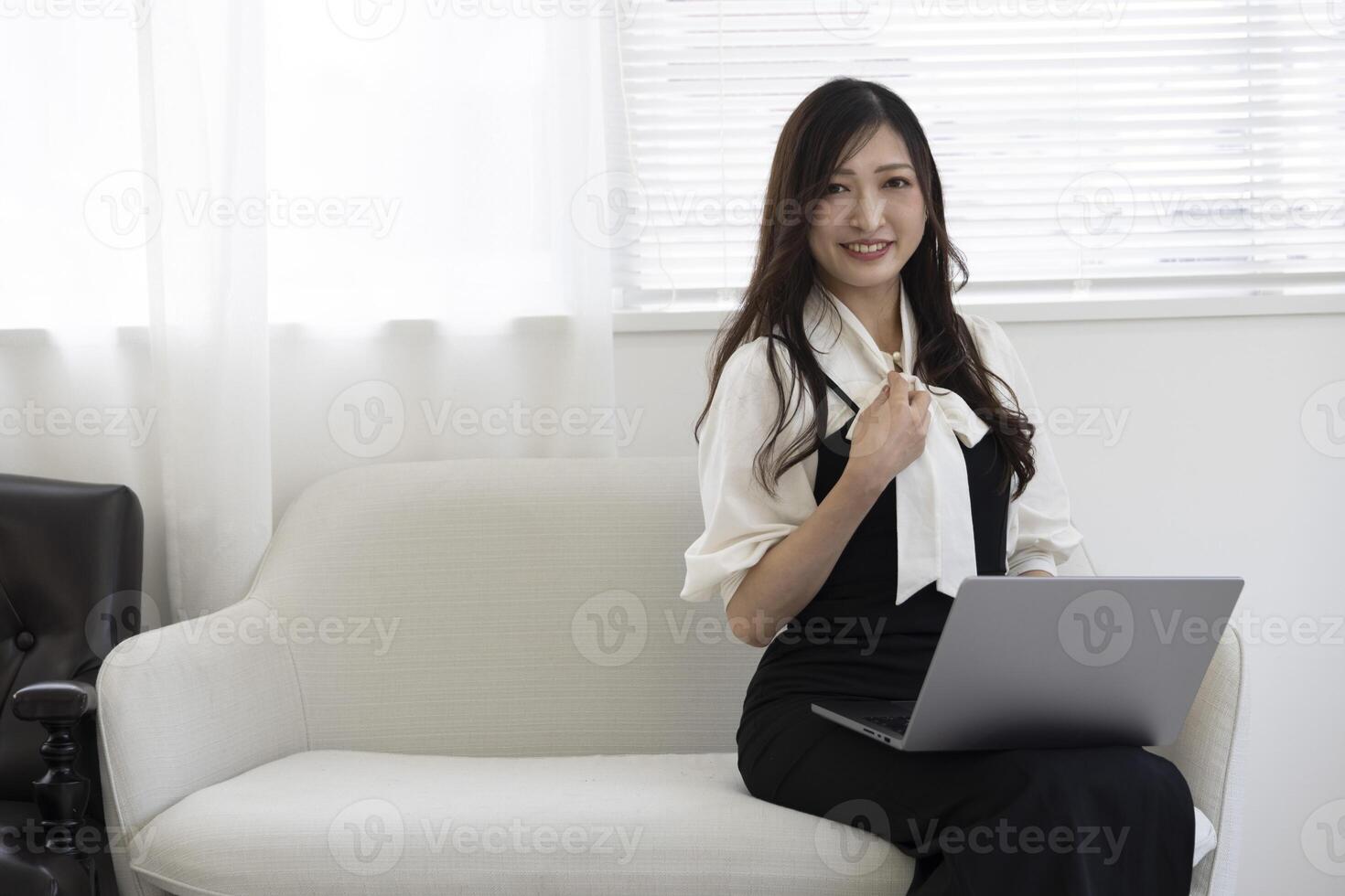 A working Japanese woman by remote work in the home office closeup photo