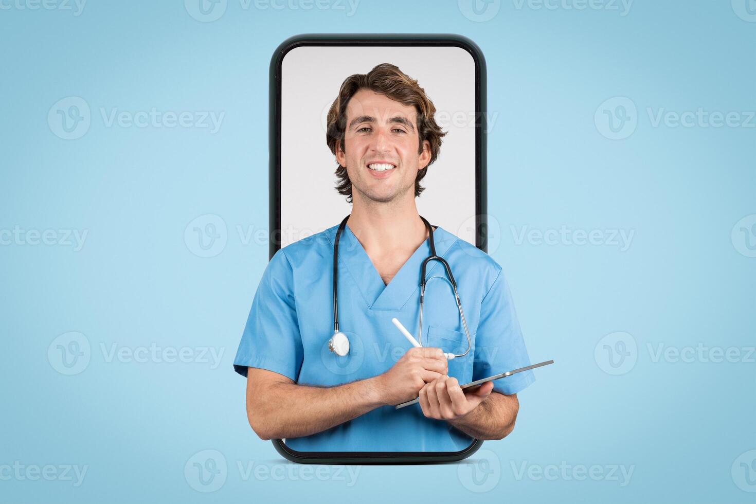 Cheerful male nurse with stethoscope using tablet on blue background photo