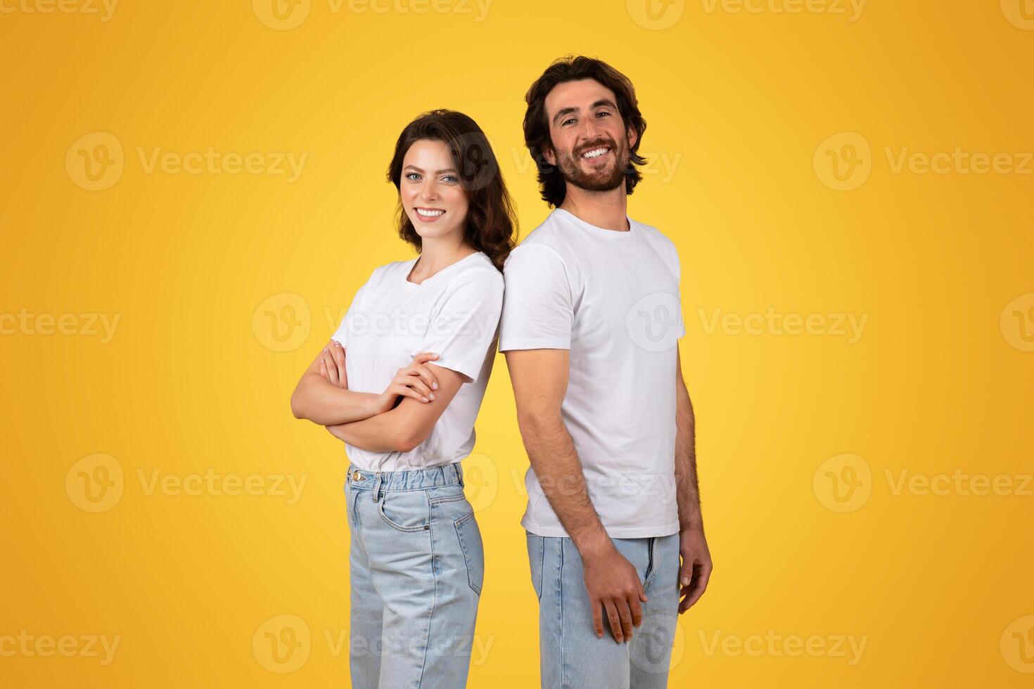 Side-by-side, a confident woman and a beaming man stand back-to-back photo