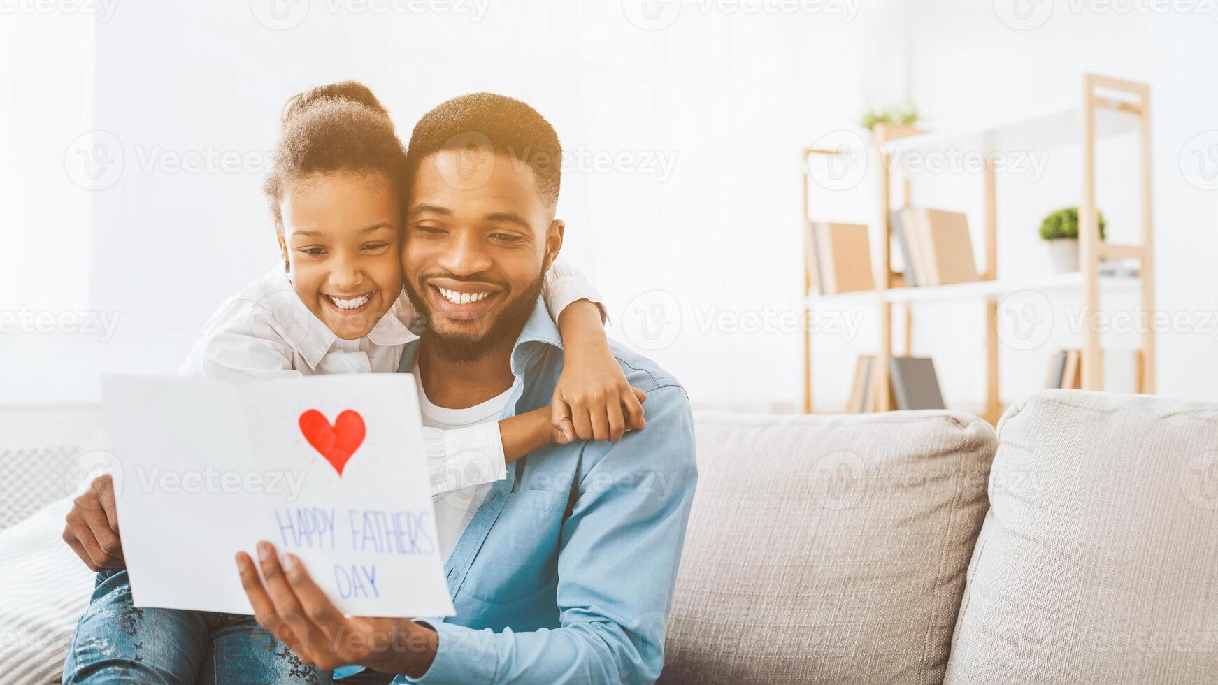 Happy father's day. Daughter congratulating dad at home photo