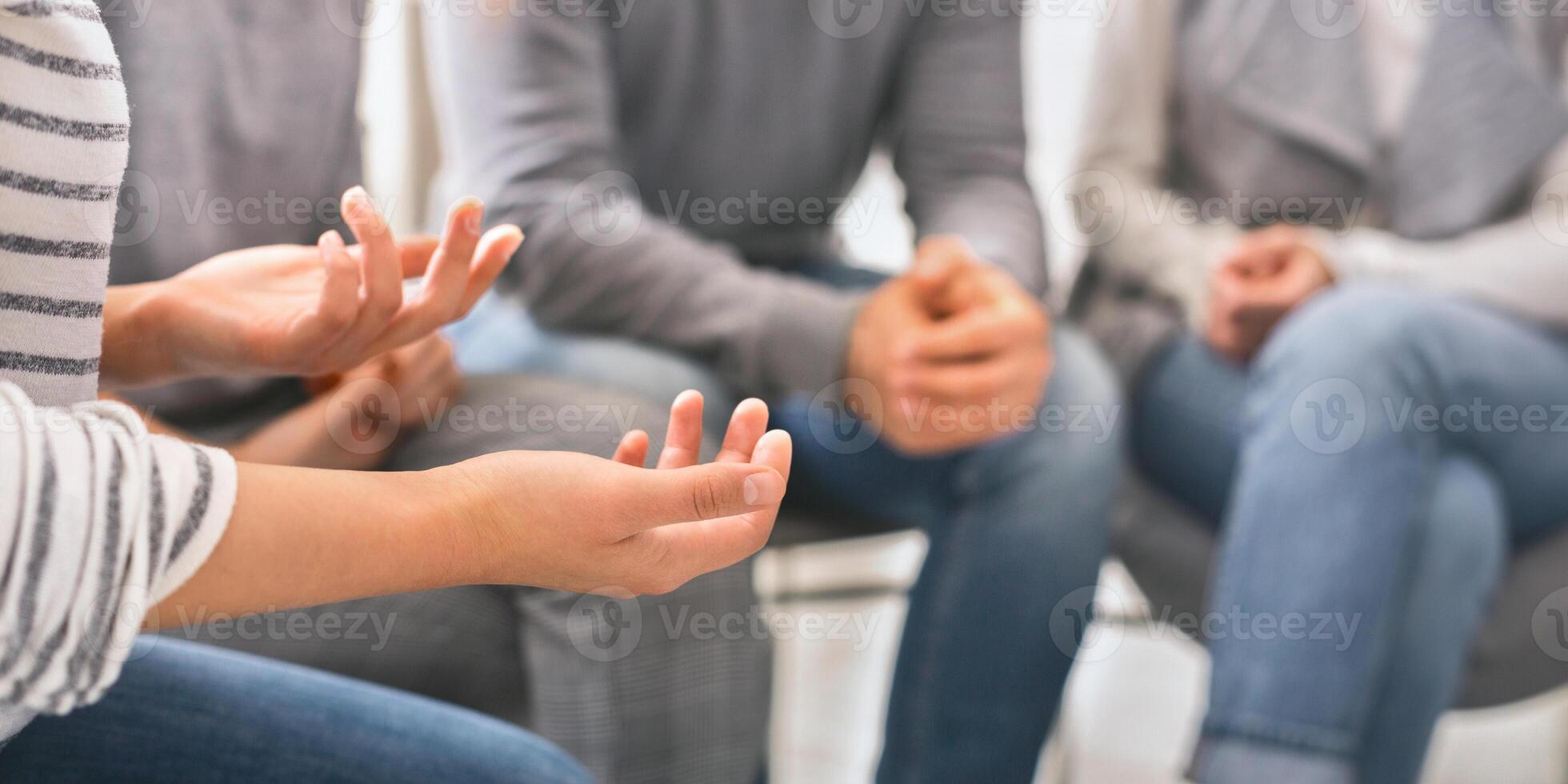 Emotional woman sharing her story during support session photo