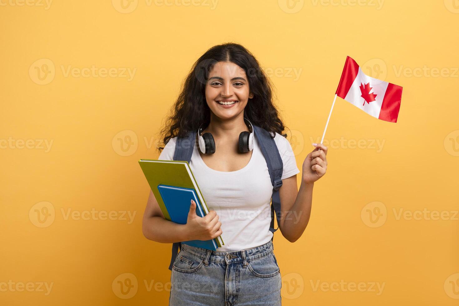 Happy student holding a Canadian flag photo