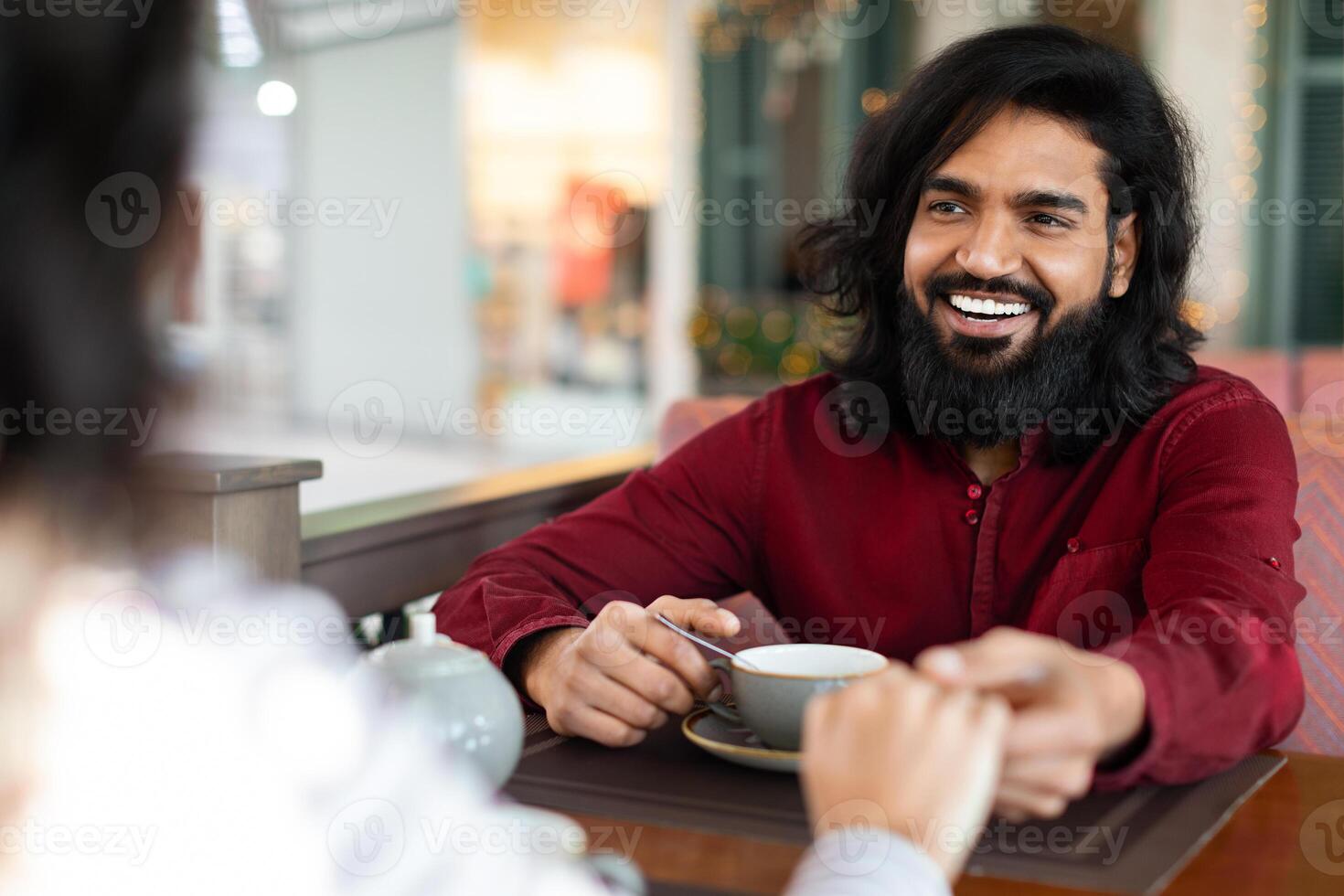 Millennial couple enjoying time together at coffee shop photo