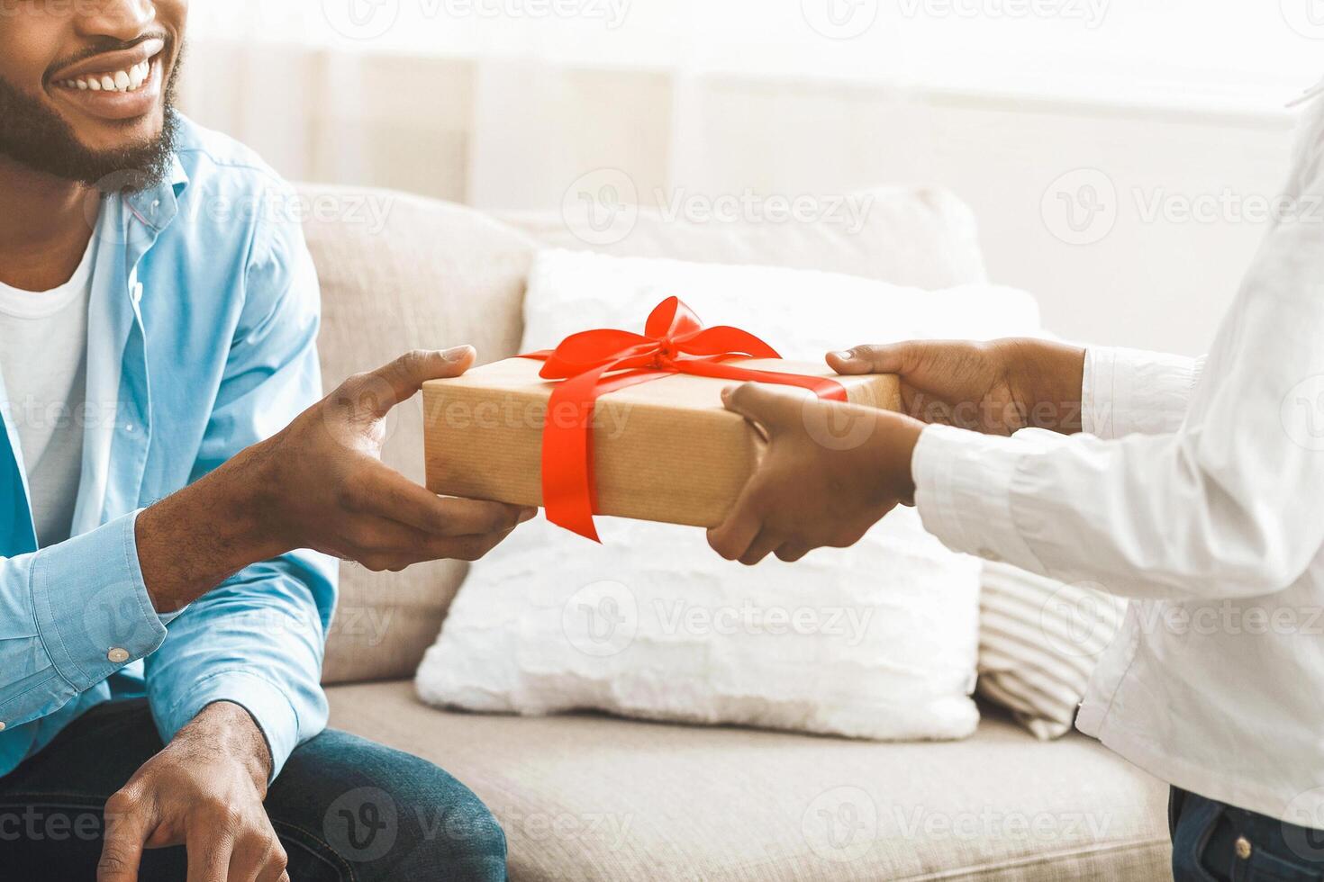 Little Girl Making Surprise For Dad, Giving Present Box photo