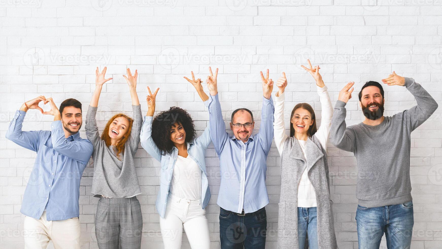 Diverse People Showing Positive Gestures, Posing Together Over White Wall Background photo
