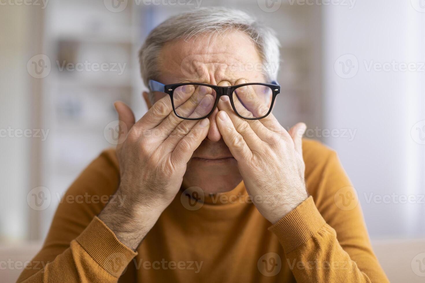 Man holding book, seeming deep in thought photo