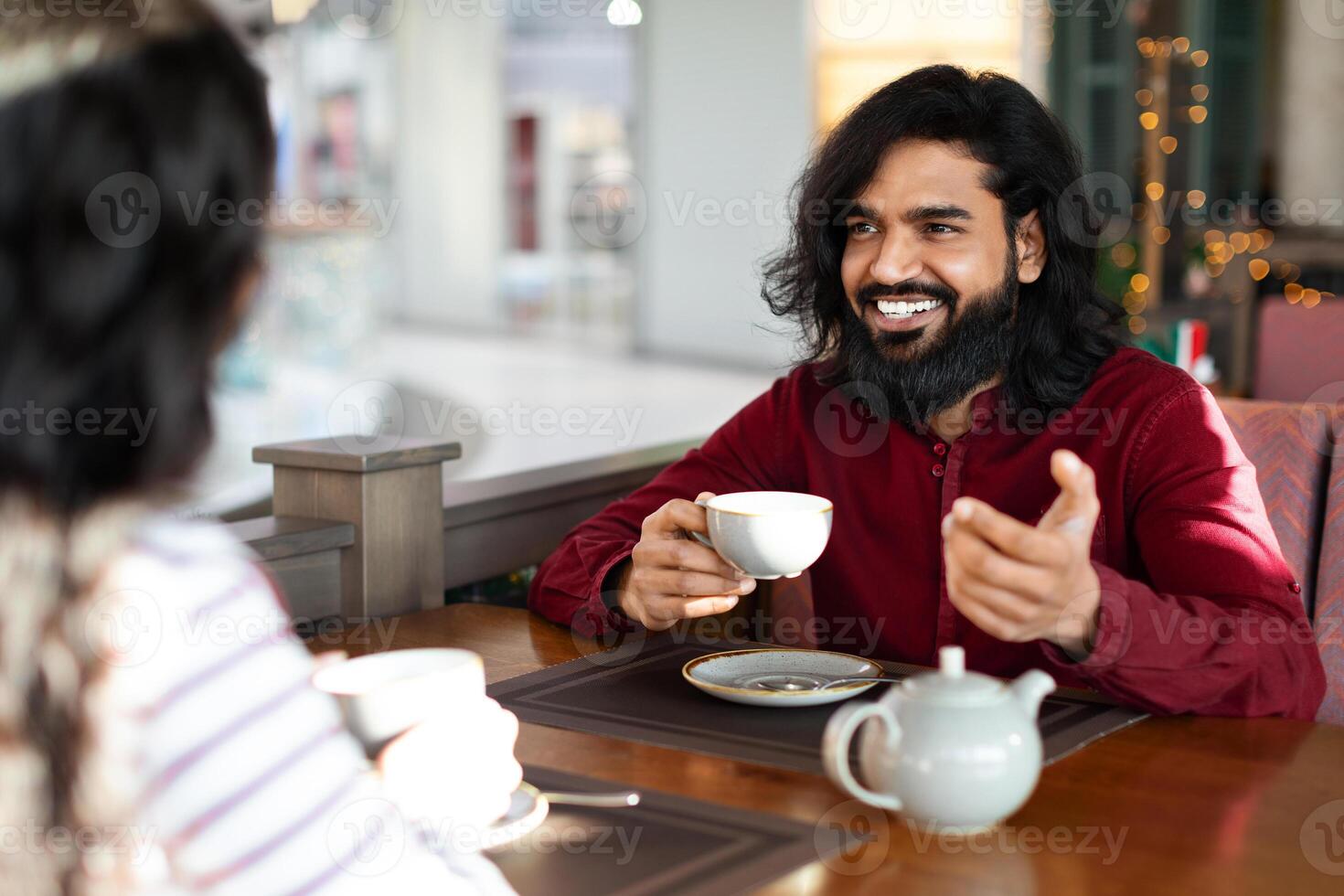 Romantic eastern couple on first date at canteen photo