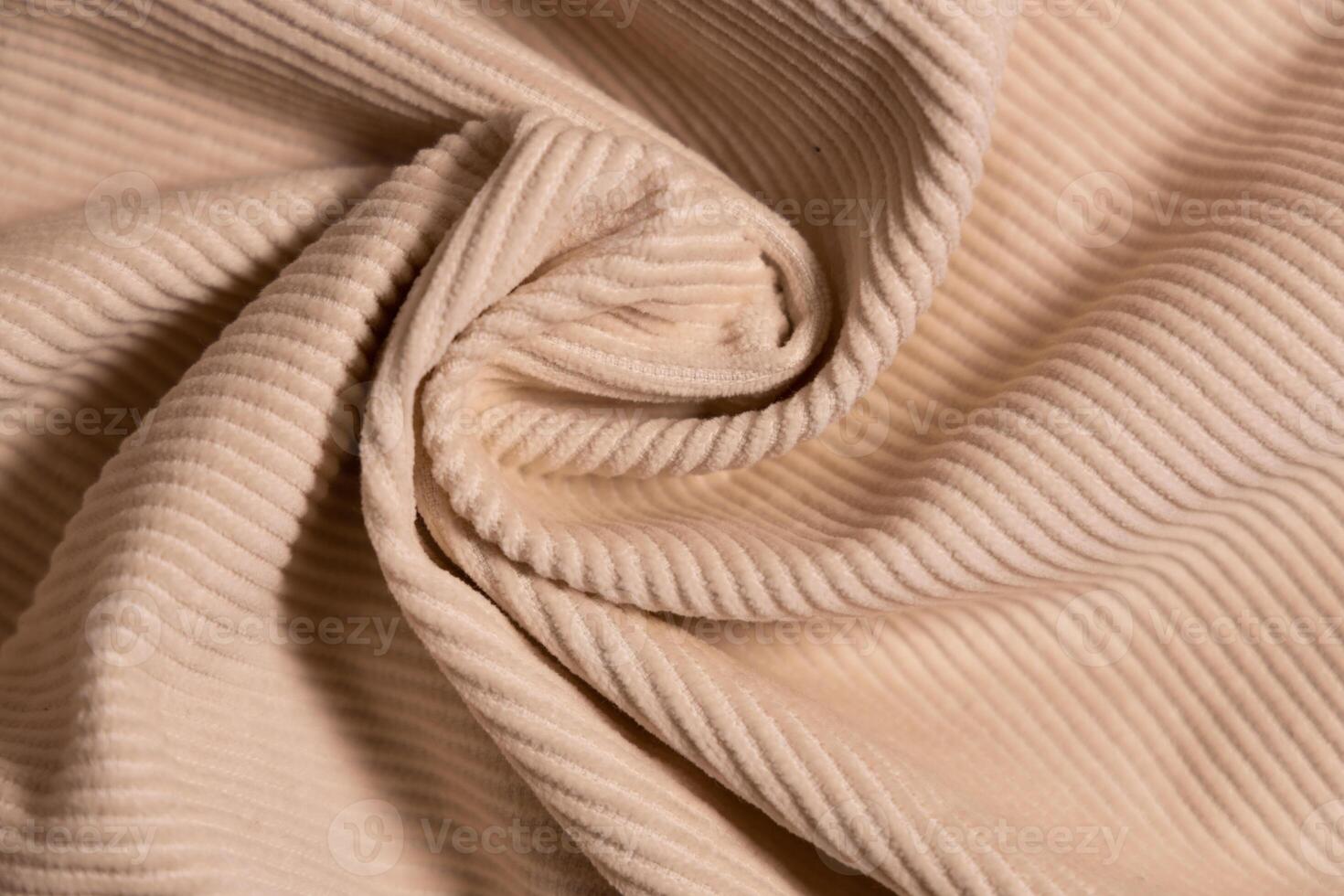 Velvety fabric texture pattern. Texture of velvet textile nude color. photo