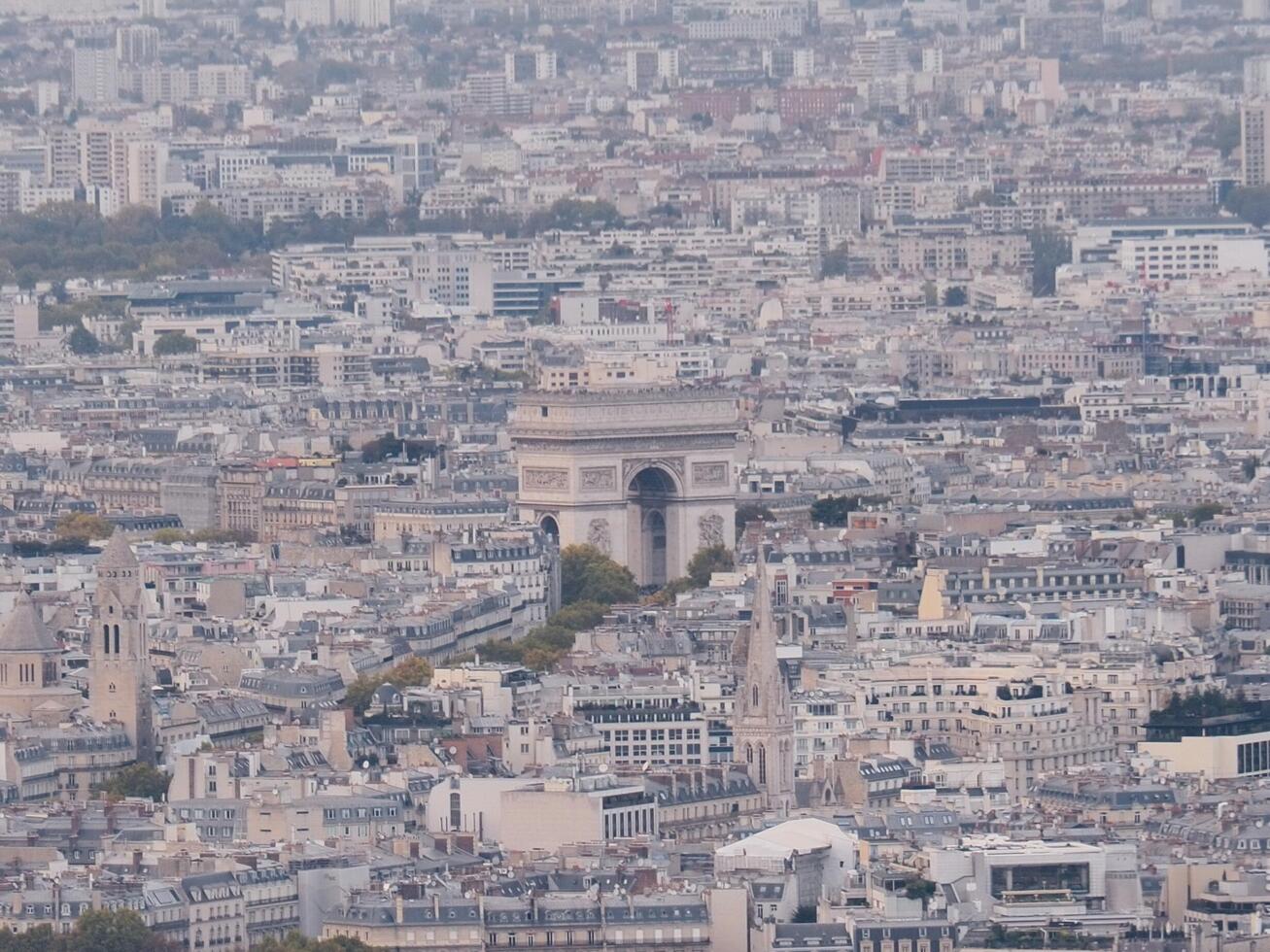 Arc de Triomphe in the evening, Paris, France. This photo features the Arc de Triomphe, a triumphal arch and major tourist landmark in Paris, France.