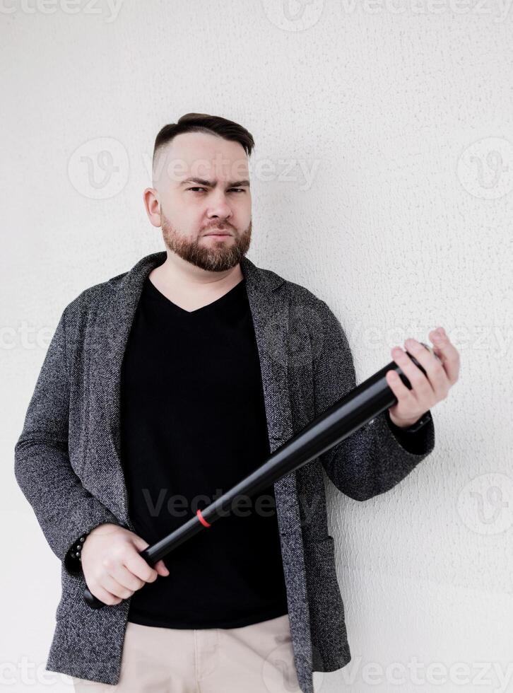 Handsome guy with baseball bat photo