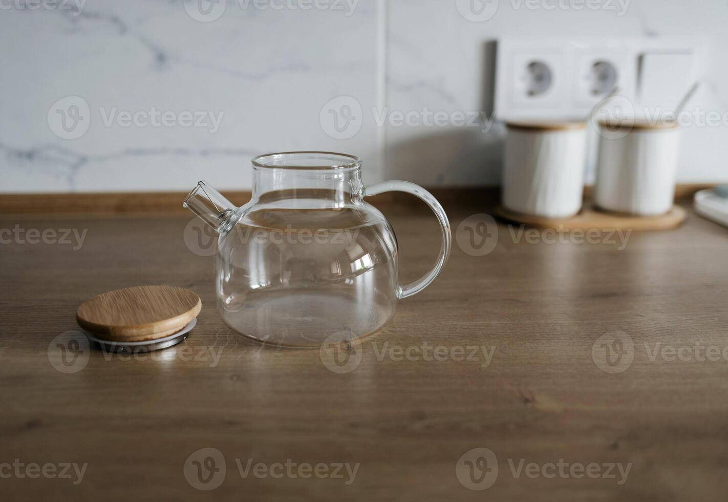 Empty glass teapot close up photo