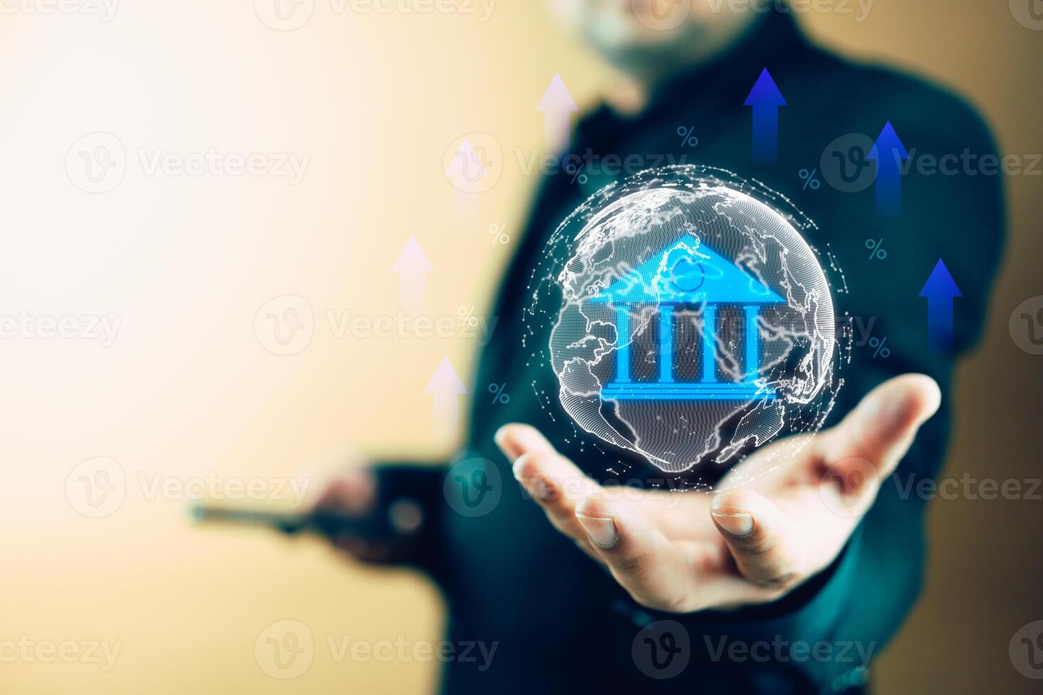 Businessman holding virtual world map and glowing percentage sign with up arrow symbol and bank icons photo