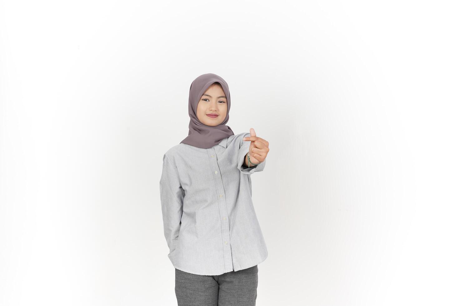Young Asian woman wearing hijab showing love finger korean isolated on white background photo